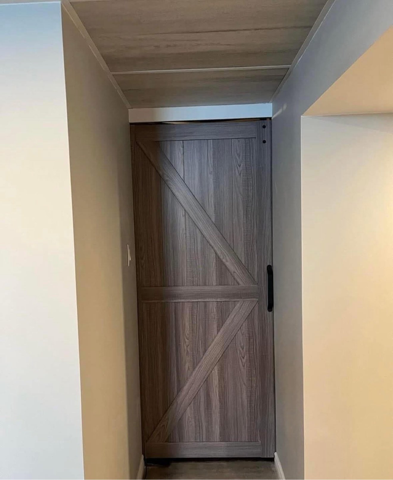 Sliding barn door in a finished basement