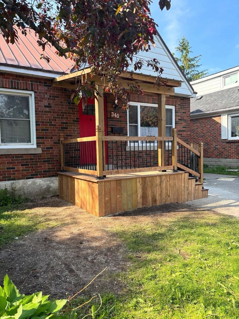 Front porch with wood railing, front view