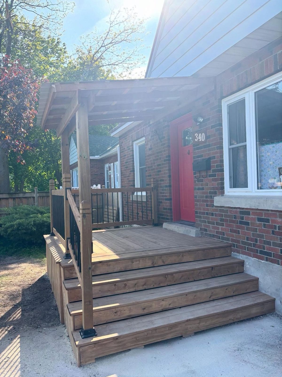 Covered wooden front porch and steps